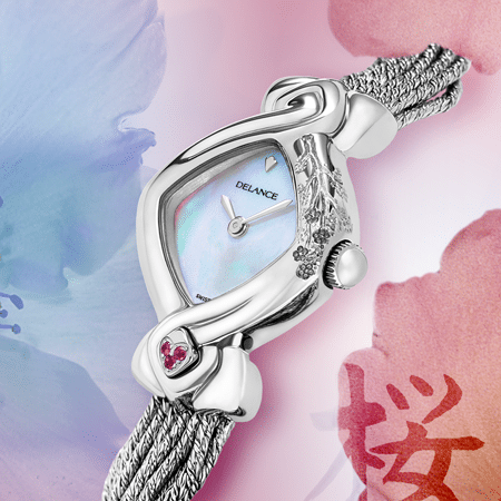 Miva acier : Montre en acier gravée à la main d'une branche de cerisier, cadran nacre blanche ou rose, aiguilles nickelées, cabochon en acier avec 3 saphirs roses à 6h, bracelet en brins d'argent