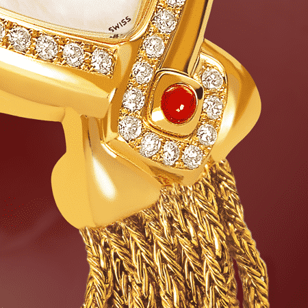 Infinity Gold cascade : Montre en or sertie avec 50 diamants, cadran nacre blanche, aiguilles dorées, cabochon en or avec un rubis, bracelet en brins